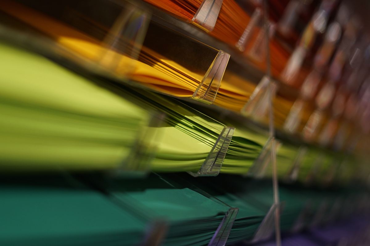 selective focus photography of yellow and green papers